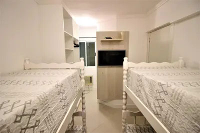 Uma cama ou camas num quarto em Edificio Vila Toscana