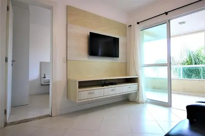 Uma televisão e/ou sistema de entretenimento em Edificio Vila Toscana