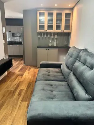 Uma área de estar em Apartamento com 2 quartos luxuoso e confortável em Itapema