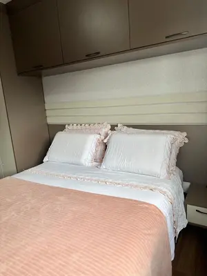 Uma cama ou camas num quarto em Apartamento com 2 quartos luxuoso e confortável em Itapema