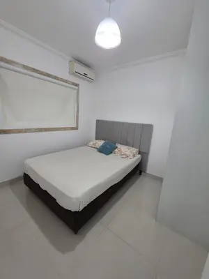 Uma cama ou camas num quarto em Flat Rota do Sol Bombinhas Centro 100 metros da praia - sem cozinha
