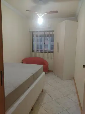 Uma cama ou camas num quarto em LINDO AP NA RUA 252, NO CORAÇÃO DE MEIA PRAIA
