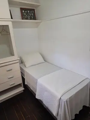 Uma cama ou camas num quarto em Pousada Caminho do Mar