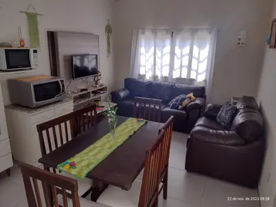 Uma área de estar em APARTAMENTO Bombinhas