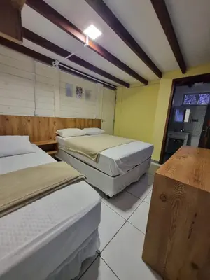 Uma cama ou camas num quarto em APARTAMENTO Bombinhas