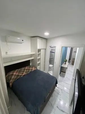 Uma cama ou camas num quarto em 204 Ótima localização de 2d em condomínio fechado