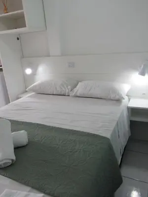 Uma cama ou camas num quarto em Pousada Vila do Navegante