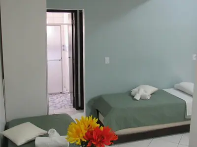 Uma cama ou camas num quarto em Pousada Vila do Navegante