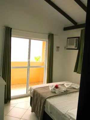 Uma cama ou camas num quarto em Pousada Vila do Navegante