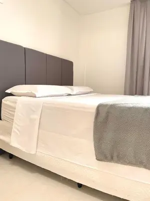 Uma cama ou camas num quarto em Conchas de Palmas