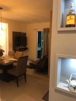 Uma televisão e/ou sistema de entretenimento em Apartamento praia de Palmas/SC