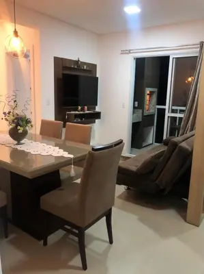 Uma área de estar em Apartamento praia de Palmas/SC