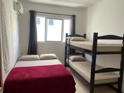 Uma cama ou camas num quarto em Apartamento na Praia de Palmas