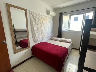 Uma cama ou camas num quarto em Apartamento na Praia de Palmas
