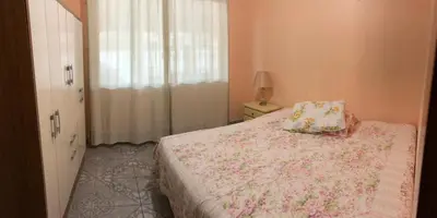 Uma cama ou camas num quarto em Residencial Marcelino