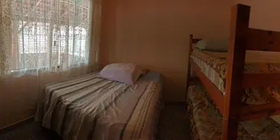 Uma cama ou camas num quarto em Residencial Marcelino