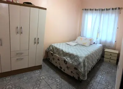 Uma cama ou camas num quarto em Residencial Marcelino