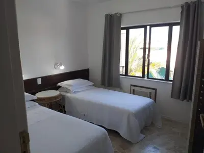 Uma cama ou camas num quarto em Czaritza Apart Hotel