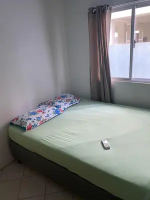 Uma cama ou camas num quarto em casa praia em bombinhas