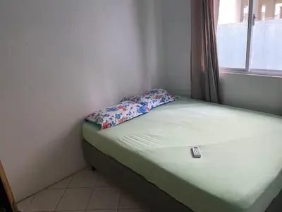 Uma cama ou camas num quarto em casa praia em bombinhas