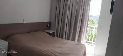 Uma cama ou camas num quarto em Bombinhas Summer Beach - Apto 303