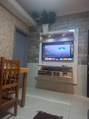 Uma televisão e/ou sistema de entretenimento em Casa 2 Encanto dos Mares