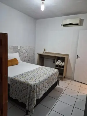 Uma cama ou camas num quarto em Casa com piscina em Balneário Camboriú