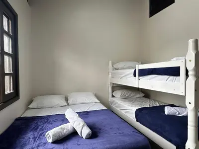 Uma cama ou camas num quarto em Residencial 305 - Localização privilegiada à 5min da praia