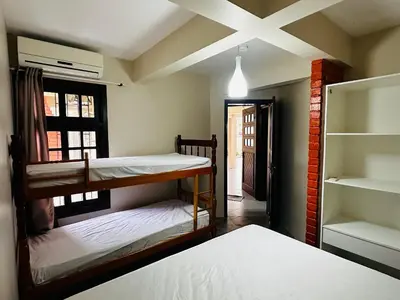 Uma cama ou camas num quarto em Residencial 305 - Localização privilegiada à 5min da praia