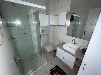 Uma casa de banho em Apto Bromélias - Meia Praia