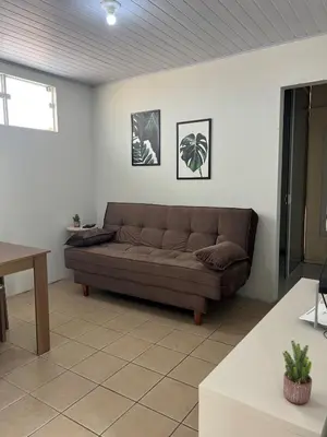 Uma área de estar em Casa entre dois mares - Casa Bege