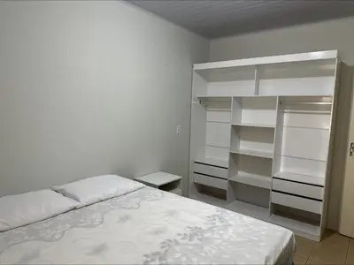 Uma cama ou camas num quarto em Casa entre dois mares - Casa Laranja