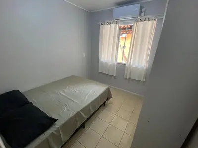 Uma cama ou camas num quarto em Casa entre dois mares - Casa Laranja