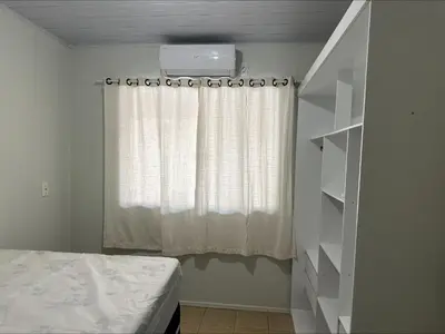 Uma cama ou camas num quarto em Casa entre dois mares - Casa Laranja