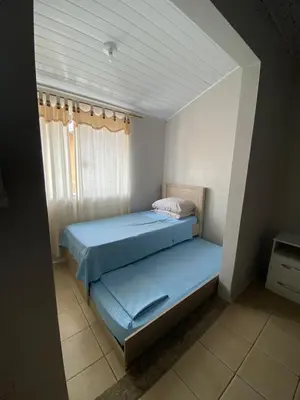 Uma cama ou camas num quarto em Casa entre dois mares - Casa Laranja