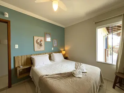 Uma cama ou camas num quarto em Hospedaria Sol da Manhã
