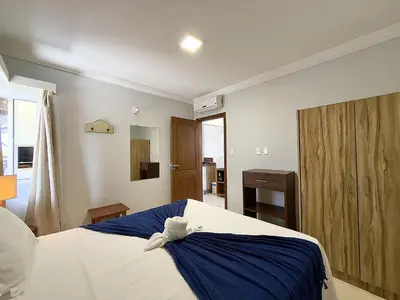 Uma cama ou camas num quarto em Hospedaria Sol da Manhã