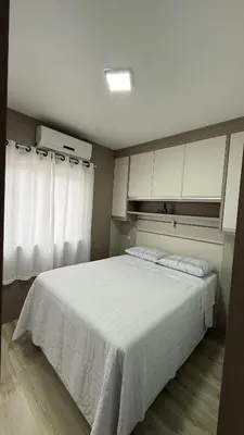 Uma cama ou camas num quarto em Residencial Bella Praia 2