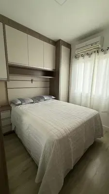 Uma cama ou camas num quarto em Residencial Bella Praia 2