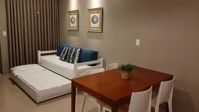 Uma cama ou camas num quarto em Mix aparts Tijucas -kit 10