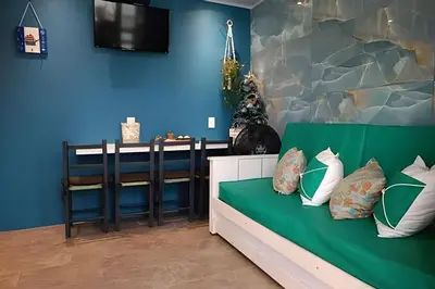 Uma cama ou camas num quarto em Apto Climatizado com varanda próximo a praia