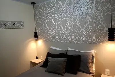 Uma cama ou camas num quarto em Apto Climatizado com varanda próximo a praia