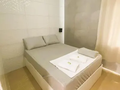 Uma cama ou camas num quarto em CASA OLINDA - XXEstudio e SuitesXX wifi Ar split e Piscina YY