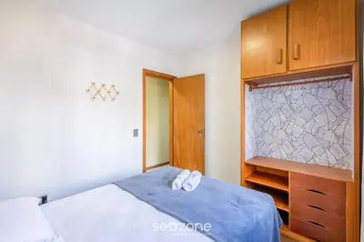 Uma cama ou camas num quarto em Apto 3Q c/ varanda 150m do mar Meia Praia EIS305