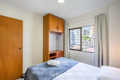 Uma cama ou camas num quarto em Apto 3Q c/ varanda 150m do mar Meia Praia EIS305