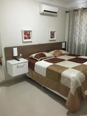 Uma cama ou camas num quarto em Apartamento privado no Bombinhas Summer Beach