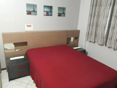 Uma cama ou camas num quarto em Apartamento Meia Praia Itapema