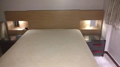 Uma cama ou camas num quarto em Apartamento Meia Praia Itapema