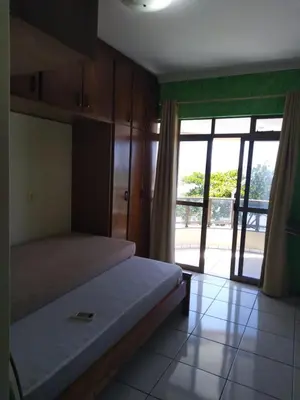 Uma cama ou camas num quarto em Paraíso Litorâneo
