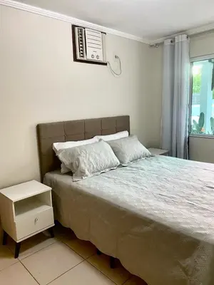 Uma cama ou camas num quarto em Casa com piscina